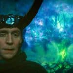 Loki wearing his new outfit as the God of Stories next to Yggdrasil, the Multiversal World Tree in Loki season 2, episode 6